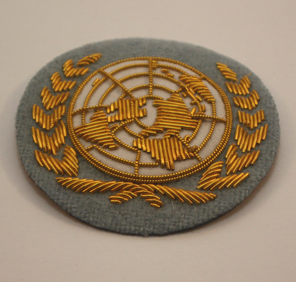 United Nations Cloth Hat Badge